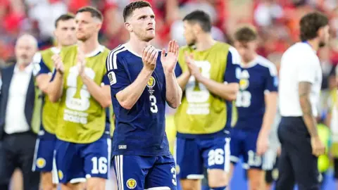 Andy Robertson applauds after Scotland's loss to Morocco