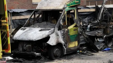 The burnt out shell of one of the ambulances