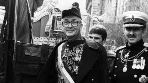 Central Press Dutch ambassador Jonkheer Huydecoper, in ceremonial uniform, sets off for Buckingham Palace to present his credentials to Queen Elizabeth II on 3 March 1982