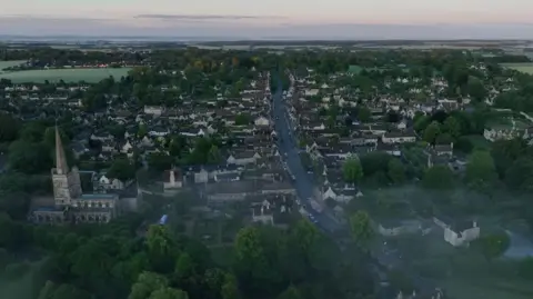 The Cotswold Explorer A drone image of Burford on a cloudy morning. Mist could be seen over the town.