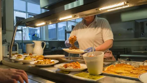 Photofusion | Getty Images School canteen hot plate