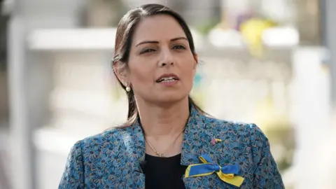 PA Wire Priti Patel visiting the Ukrainian embassy in London