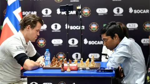 AFP india's Rameshbabu Praggnanandhaa (R) competes against Norway's Magnus Carlsen (L) during the final at the FIDE Chess World Cup in Baku on August 24, 2023