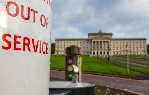 AFP A sign on a drinking fountain outside Stormont's Parliament Buildings that reads: Out of service