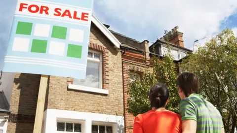 Getty Images Couple looking at house for sale