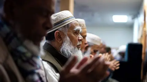 Getty Images Muslim men pray during their weekly Friday noon special prayer at the Al-Islah Islamic Center Mosque in Hamtramck, Michigan.