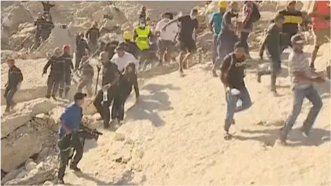 People run following earthquake aftershock