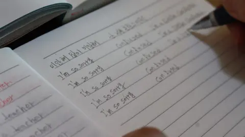BBC Korean Close-up of Han Tae-soon's English writing in an exercise book. She has written the words "I'm so sorry" and "confused" repeatedly
