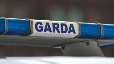 Garda sign on police car