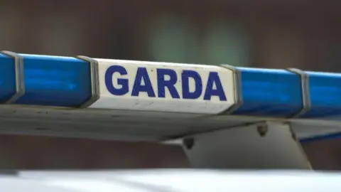 Garda sign on police car