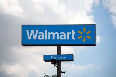 Walmart logo sign is seen in Chicago, Illinois, United States, on August 3, 2026. The signage displays the branding of an American retail corporation operating supermarkets, hypermarkets and discount stores. 