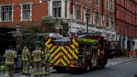 Reuters Firefighters attend the scene of a fire at the Chiltern Firehouse hotel in London, Britain, February 15, 2025