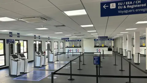 PA Media A newly built room for border controls, housing automatic machines that will be used to register fingerprints and photos under the Entry Exit System, and booths for French border police. The machines are not yet in use.