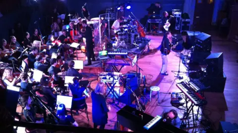 A shot of Stornoway on stage, taken from an audience balcony.