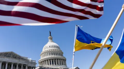 Getty Images American and Ukrainian flags fly near the U.S. Capitol on April 20, 2024 in Washington, DC. The House is passed a $95 billion foreign aid package today for Ukraine, Israel and Taiwan.