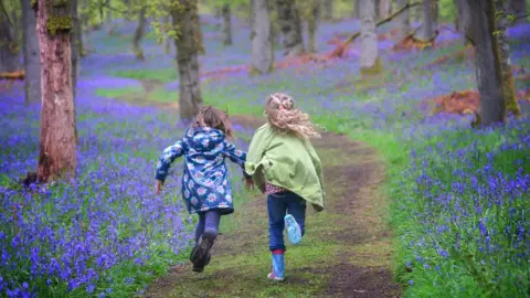 Woodland Trust Children in a bluebell wood