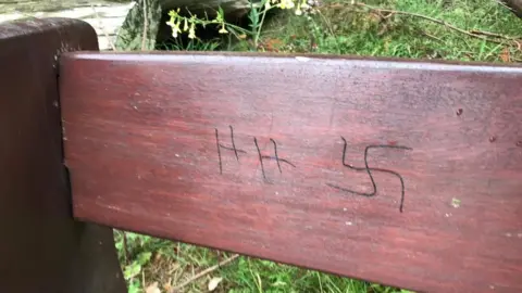 Nazi graffiti on a bench