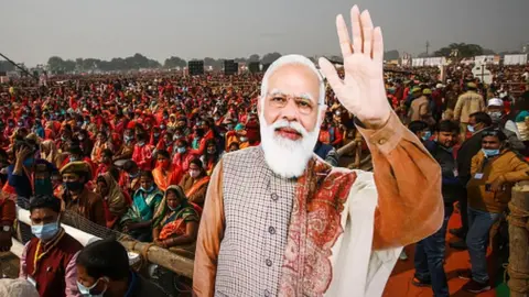 Women from various districts are seen near cut-outs of India's Prime Minister Narendra Modi at a rally held by Modi on December 21, 2021 in Allahabad, India.