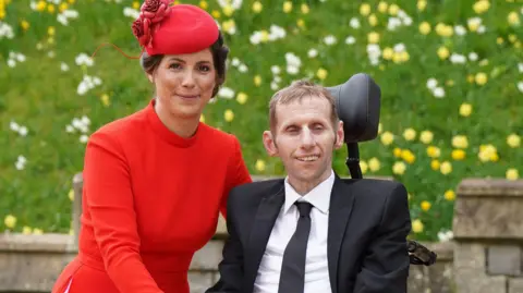 PA Media 05/04/22 of former rugby league player Rob Burrow and his wife Lindsey arriving at Windsor Castle to receive his Member of the Order of the British Empire (MBE)