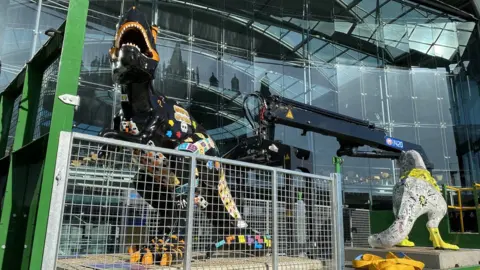 Martin Barber/BBC Dinosaur statues being put in place