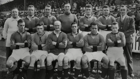 Colorsport/Shutterstock Football - 1927 / 1928 season - Plymouth Argyle team group Back (left to right): J Haynes (trainer) Frederick McKenzie Robert 'Bob' Preston Frederick Craig Frederick Titmuss (2 England caps) Alex Hardie James 'Jimmy' Logan Front: Alfred Matthews Francis 'Frank' Sloan Moses Russell (captain; 23 Wales caps) Frederick Forbes Jack Leslie Samuel 'Sammy' Black Plymouth Argyle - 1927/28.