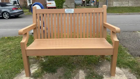 The commemorative bench for Ketan Shah in Shipton Bellinger.
