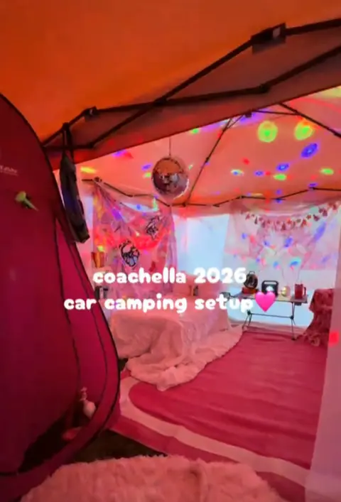 Ali Calder Picture of Coachella camping gazebo with a pink theme, memory foam mattress bed and portable shower.