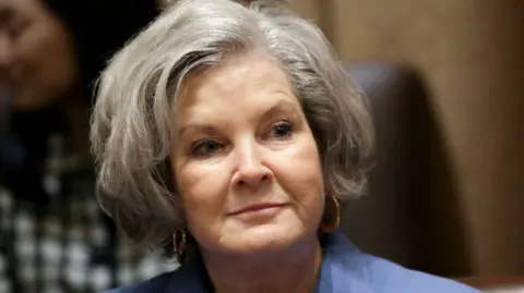 Getty Images Susie Wiles, wearing a blue blazer, at the White House in March 2025