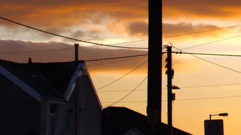 Getty Images Home with telegraph pole