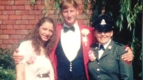 PA Media Denise Kidger (right) with with her late brother Stephen and her sister Tracey-Ann Knight