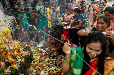 Francis Mascarenhas / Reuters Women offering prayers in Mumbai