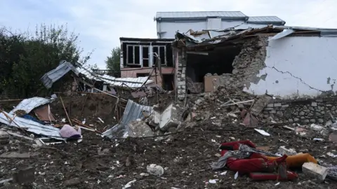 Reuters A house destroyed by shelling in Stepanakert, Nagorno-Karabakh