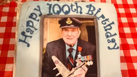 BBC Colin Deverell's birthday cake featuring a picture of him