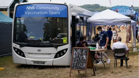 PA Media A Covid-19 vaccination bus at Latitude festival in Henham Park, Southwold, Suffolk