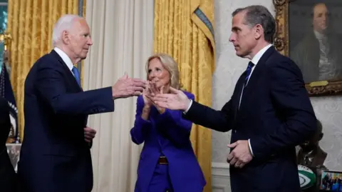 Getty Images President Biden embraced his son following the announcement that he would not seek a second term