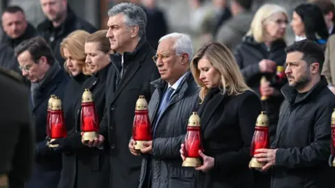 EPA/Shutterstock Volodymyr Zelensky and world leaders at a memorial event