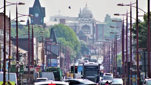 Soho road in Birmingham with cars and lorries driving on the road
