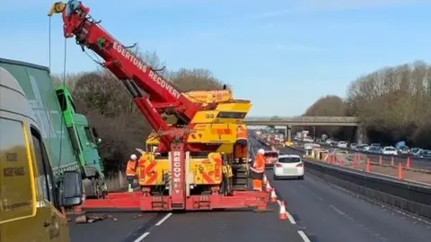 Highways England Lorry being recovered from ditch