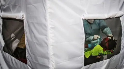 Getty Images A man is tested for the novel coronavirus, COVID-19, in Vrededorp, Johannesburg, on June 5, 2020.