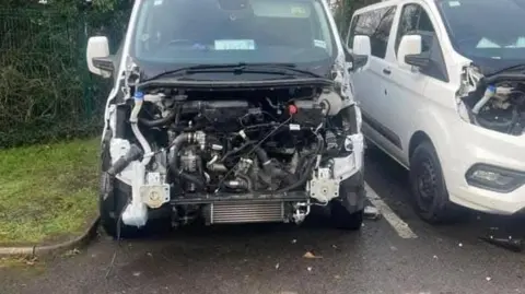 Robbed minibuses with bonnet ripped out