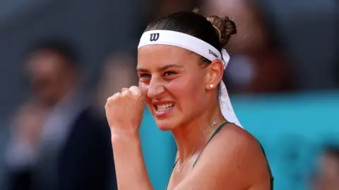 Marta Kostyuk clenches a fist