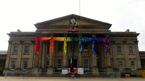 Huddersfield railway station covered in knitted squares