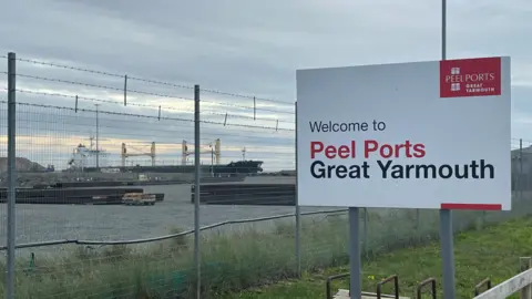 Andrew Turner/BBC Peel Ports sign at Great Yarmouth with ships in the background