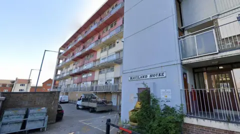 Google image of the outside of Haviland House. The outside of the building varies in colour - from pink to cream to light blue.