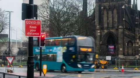 Getty Images A bus travels past St Thomas' Church in Newcastle city centre