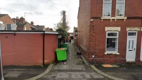 Google Maps The alley between Apley Road and Whitburn Road in Doncaster - which has green bins and red brick houses