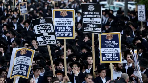 Reuters File photo showing ultra-Orthodox men and boys protesting in Jerusalem against the conscription of yeshiva students in Israel's military (11 April 2024) 
