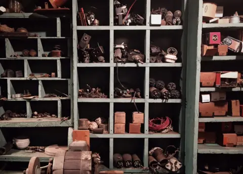 Snell Mills Crystal radio coils, switches, model train parts, vacuum tubes, and assorted wires.