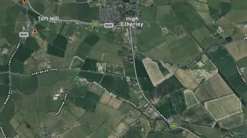 LDRS An aerial view of Toft Hill and High Etherley villages in County Durham showing a patchwork of fields and roads. High Etherley is in the centre with Toft Hill to the left, but the latter is a much smaller village 