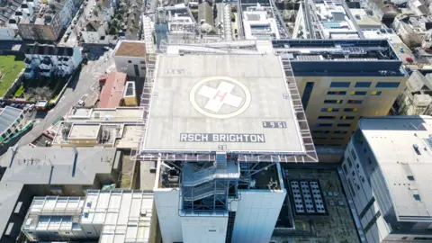 Aerial drone image of the helipad atop a hospital.